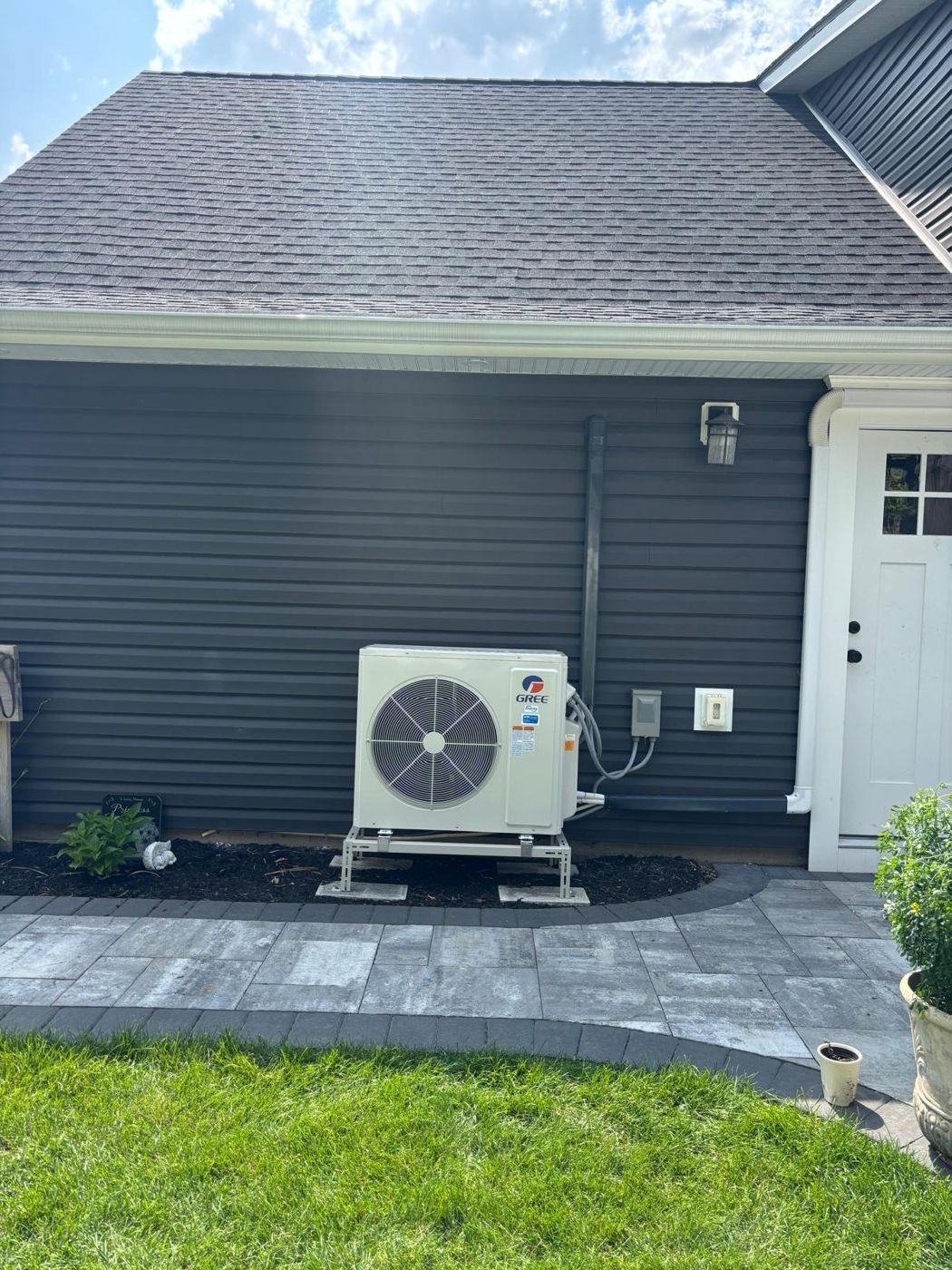 Clean outdoor heat pump installation on a Long Island home