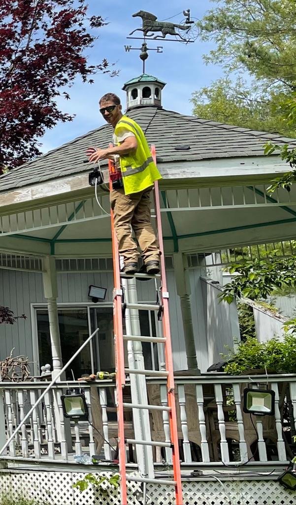 Father & Son team working on a gazebo roof